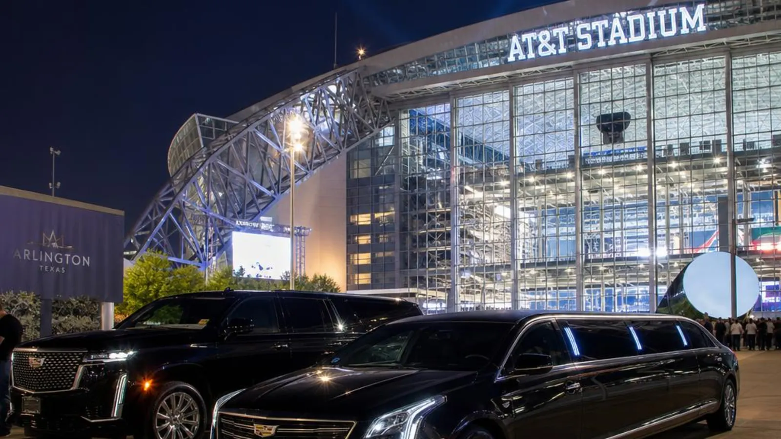 Guests stepping out of a black stretch limousine at a DFW evening event